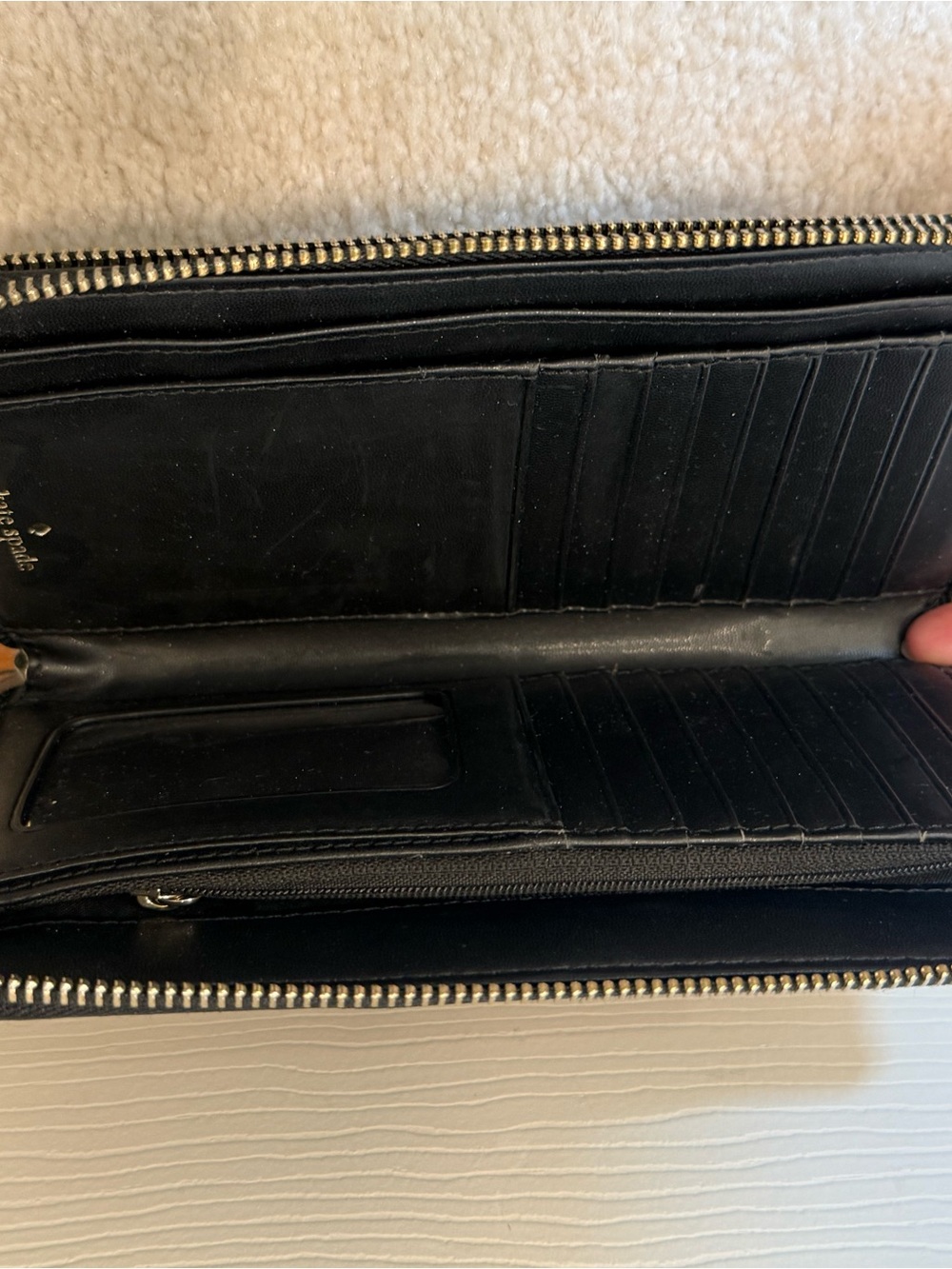 kate spade Black Zip-Around Leather Wallet with wrist strap and phone pocket